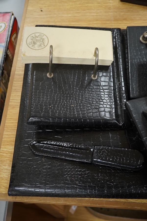 A seven-piece crocodile skin-effect desk set